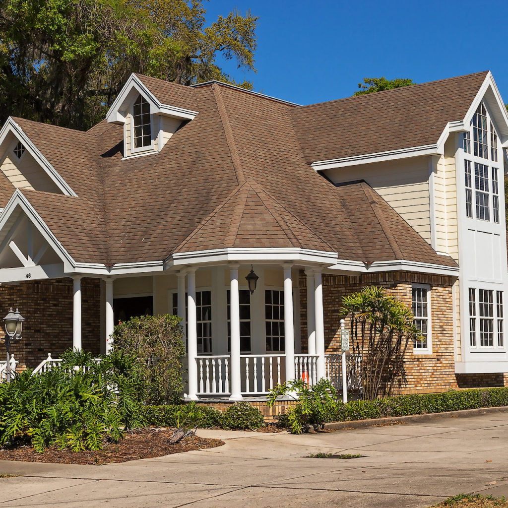 Image of a house with a brown roof for the neighborhoods in fairhope al Blog Article