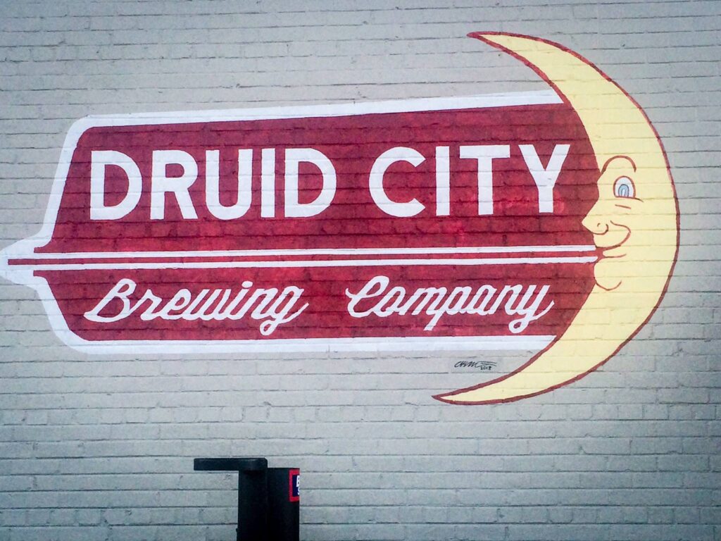 Logo wall photo for the Druid City Brewing Company Lifestyle Guide Page